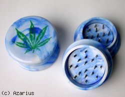 Blue plastic grinder with leaf